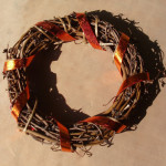 Wrap the foiled tape around the wreath.