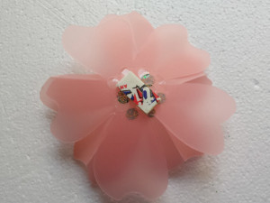 Attach a KoolTak Foam Pad to the back of the flower and set aside.