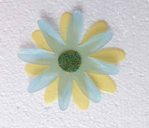 Cover the center of the top flower with KoolTak Sparkles Green Microbeads.