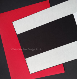 Place the strips of Kool Tak™ Punch Adhesive Sheet along three sides of the black card stock.