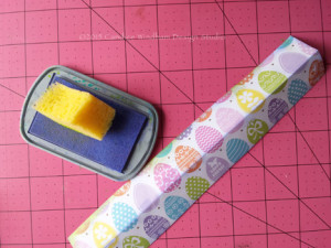 Cut 2" x 0" stri[s and then score and fold to 1" x 9" strips. Sponge edges.