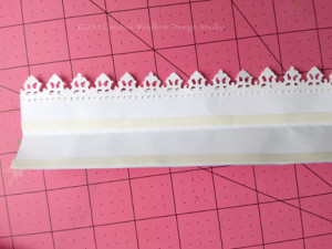 Add paper lace to the 1/8 strip on the topper.